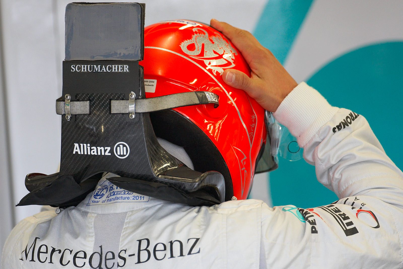 Michael Schumacher, Mercedes GP, puts his helmet on