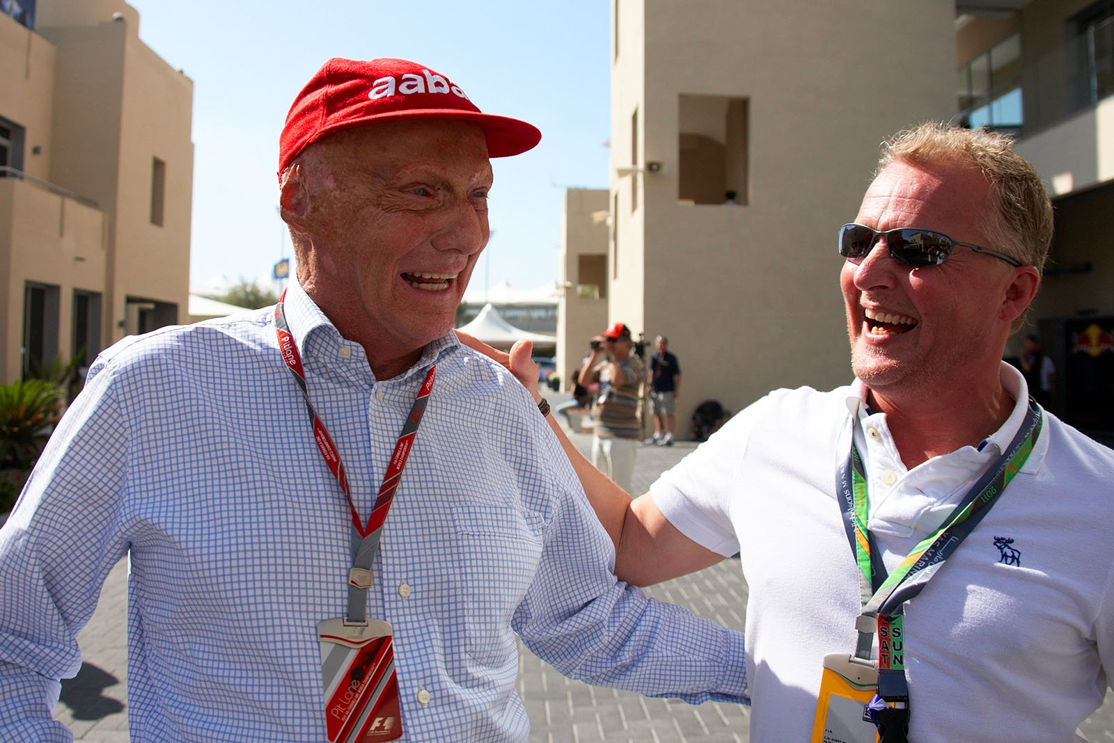 Niki Lauda jokes around with Johnny Herbert, both former F1 drivers and now advisers and TV presenters
