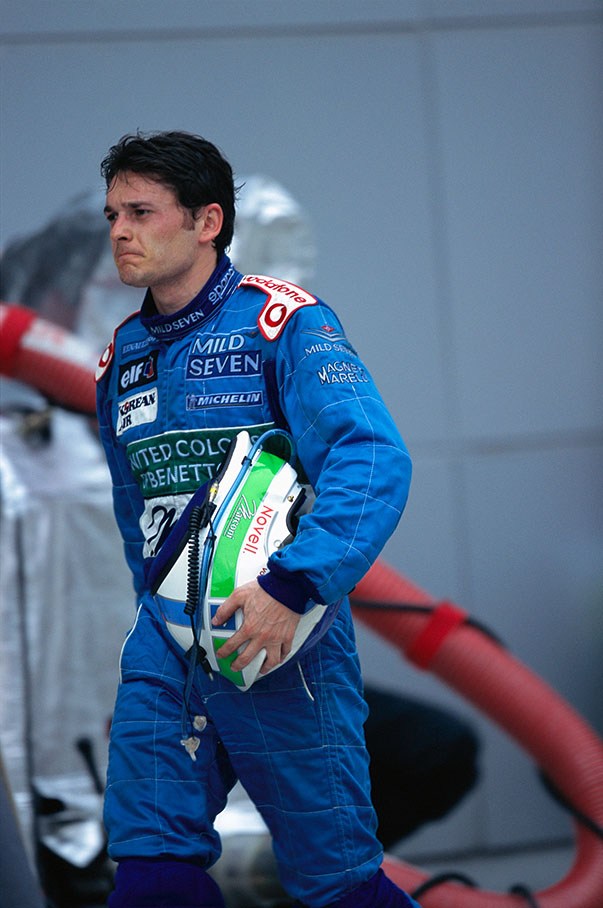 Giancarlo Fisichella walks back after retiring in lap 32
