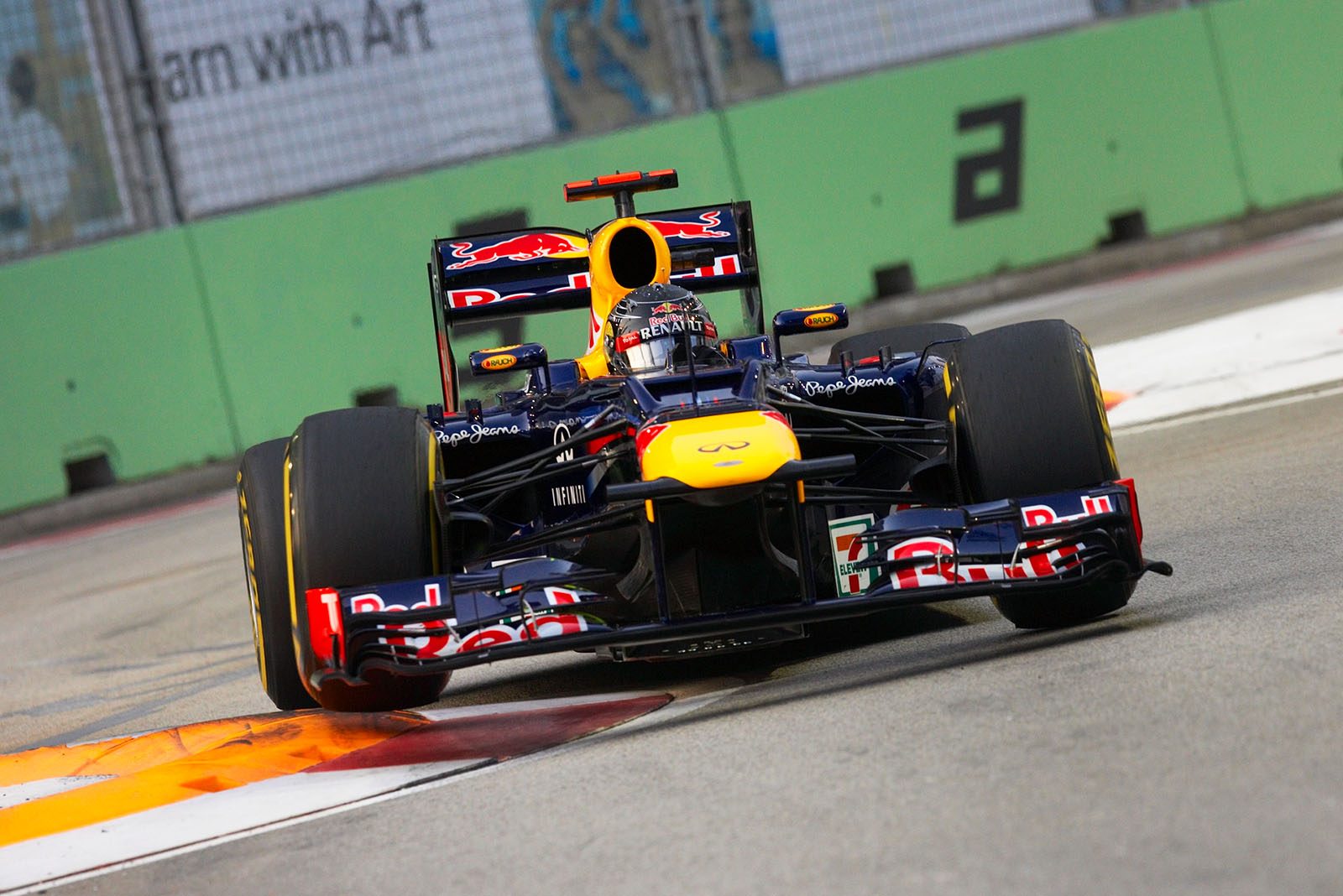Sebastian Vettel, Red Bull Racing, jumps over the curbs