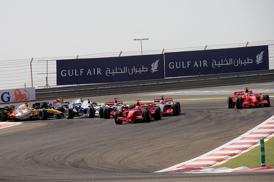 The start field at first corner, note how far Kimi Raikkonen pulls out