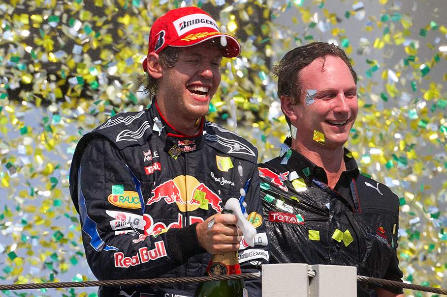 Champagne and glitter showers for race winner Sebastian Vettel and new Constructor World Champion Red Bull Team boss Christian Horner