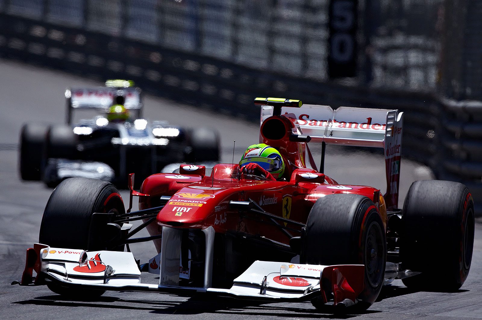 Felipe Massa of Ferrari leading Maldonado.