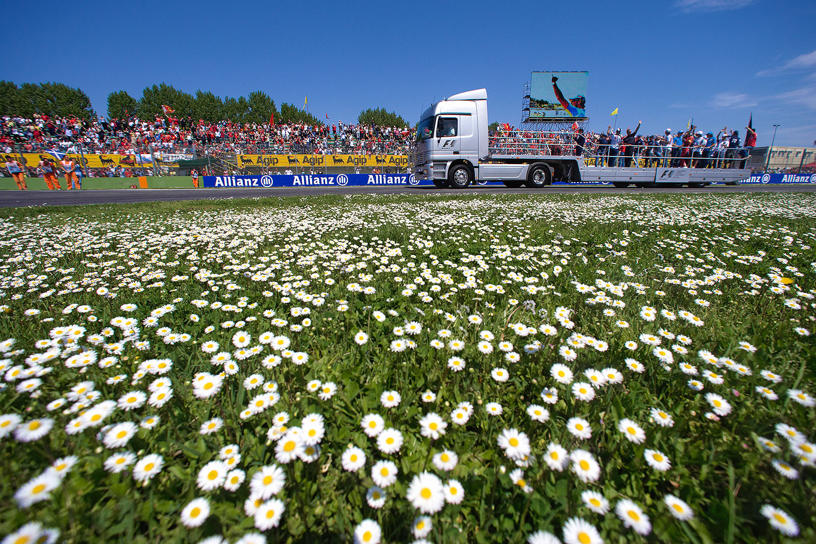Fisichella on screen behind driver's display truck