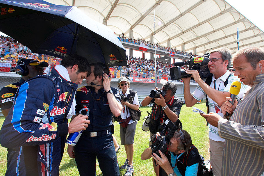 Mark Webber on pole position is being interviewed besides the grid before the race