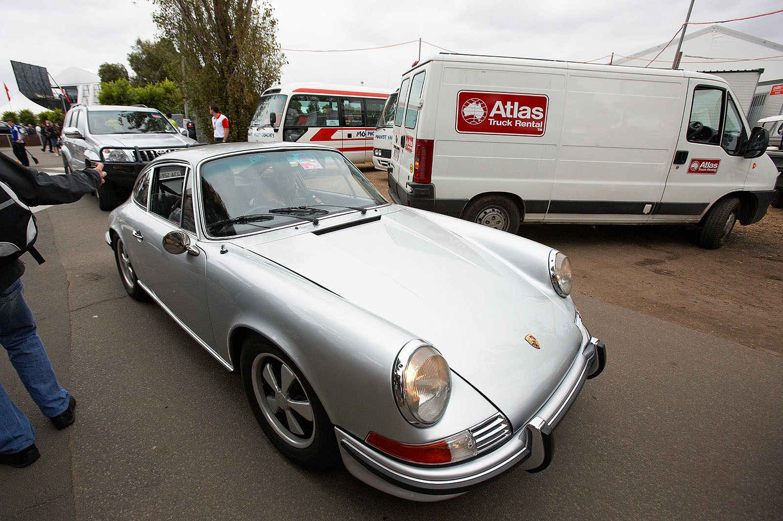 Sebastian Vettel arrives in a historic Porsche