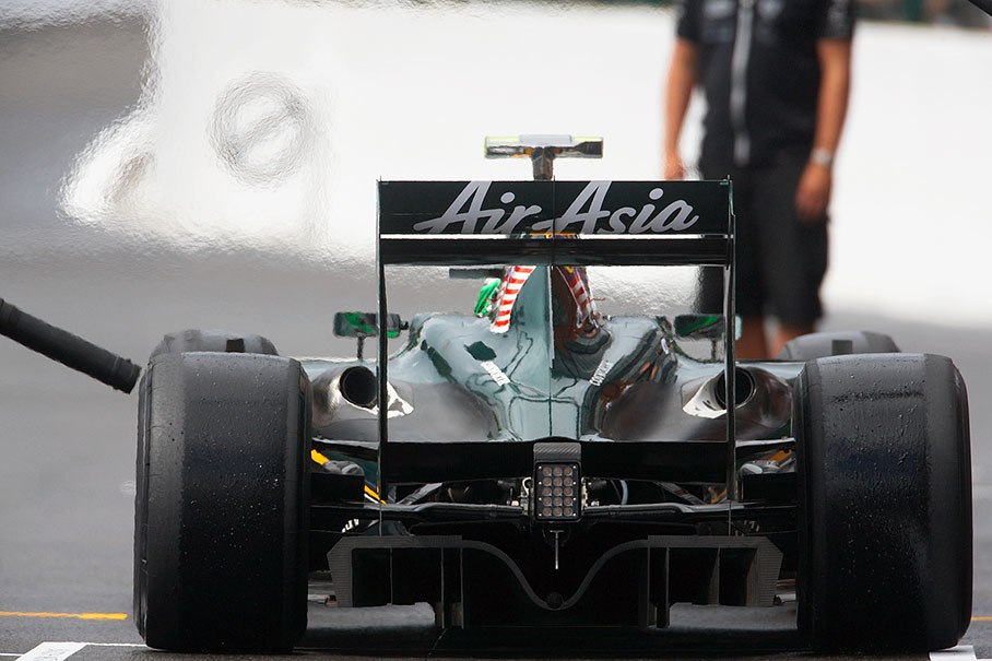 Heikki Kovalainen at Lotus Racing pits