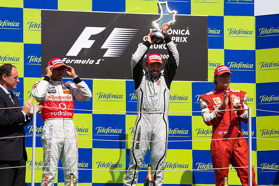 Race winner Rubens Barrichello raises his tropy at podium ceremony