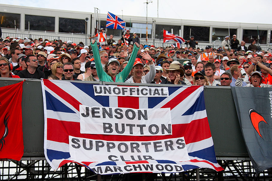 Button's fans wave hellos from the grandstand