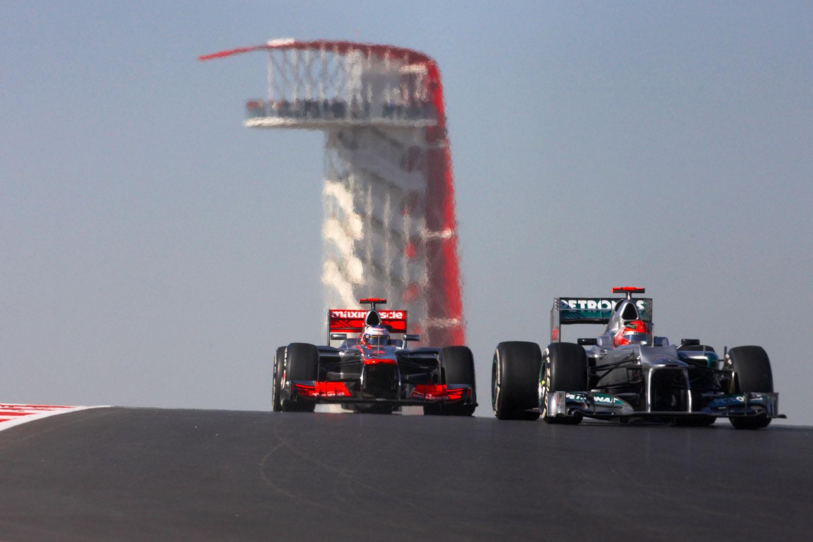Michael Schumacher, Mercedes GP, in front of Button