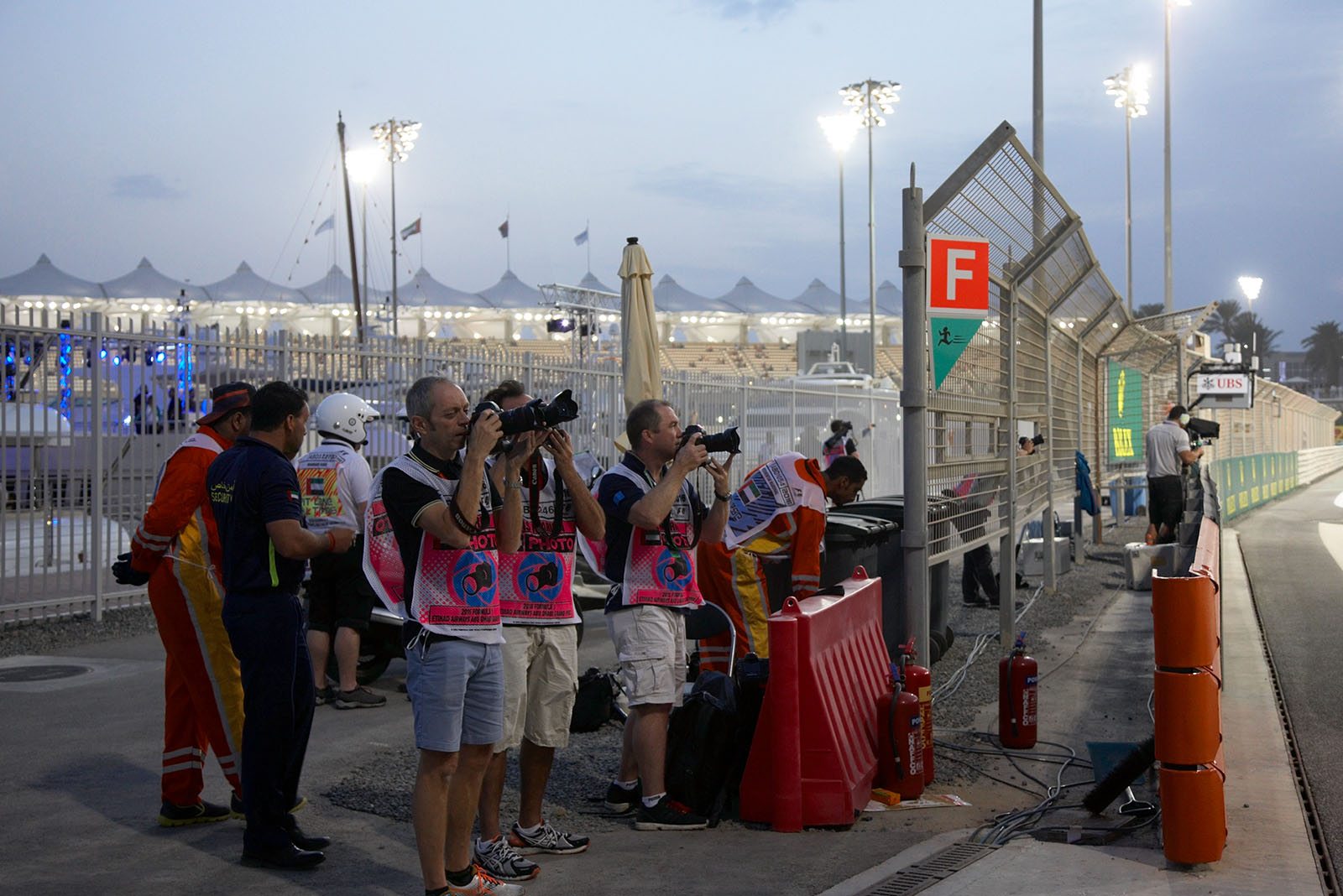 Photographers, among them Mark Thompson of Getty Images, at the race track, Abu Dhabi Grand Prix, 2016