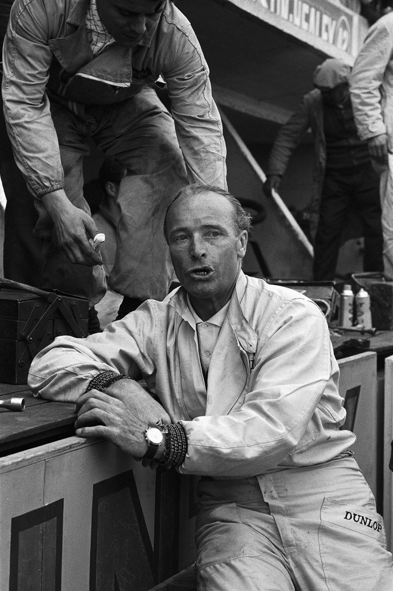 A totally exhausted Edgar Barth (DDR) gaps for breath at Porsche pits. He just had to push his and Herbert Linge's (D) Porsche 718 WRS (047) back to pits for the last few 100 metres because it lost a wheel. No help was allowed by racing rules!