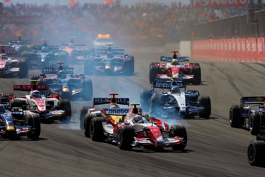Fisichella slips into Trulli's rear during start