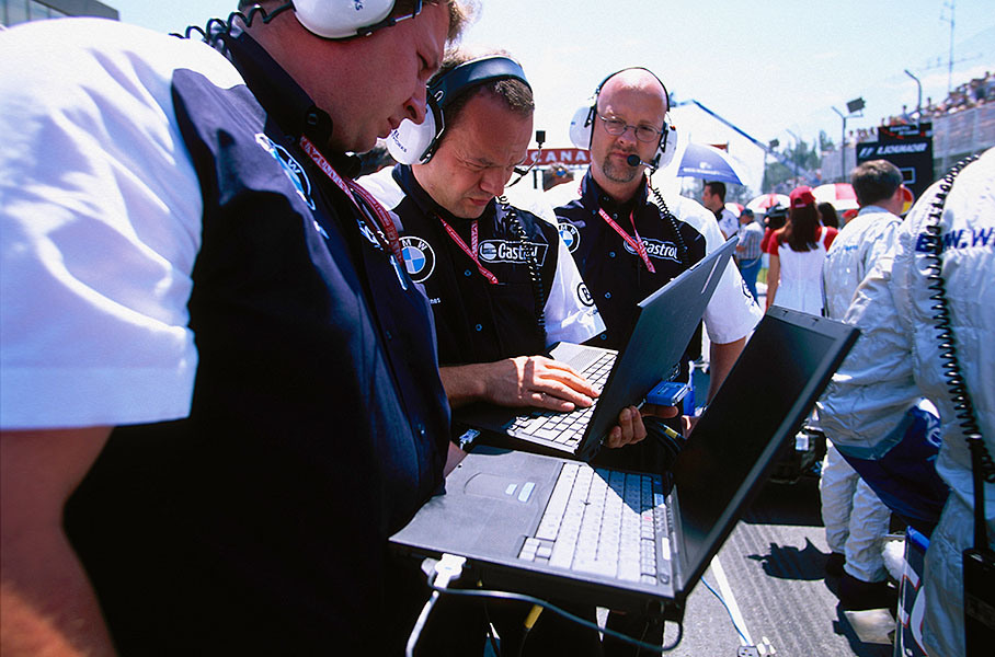 McLaren mechanics at work on the grid