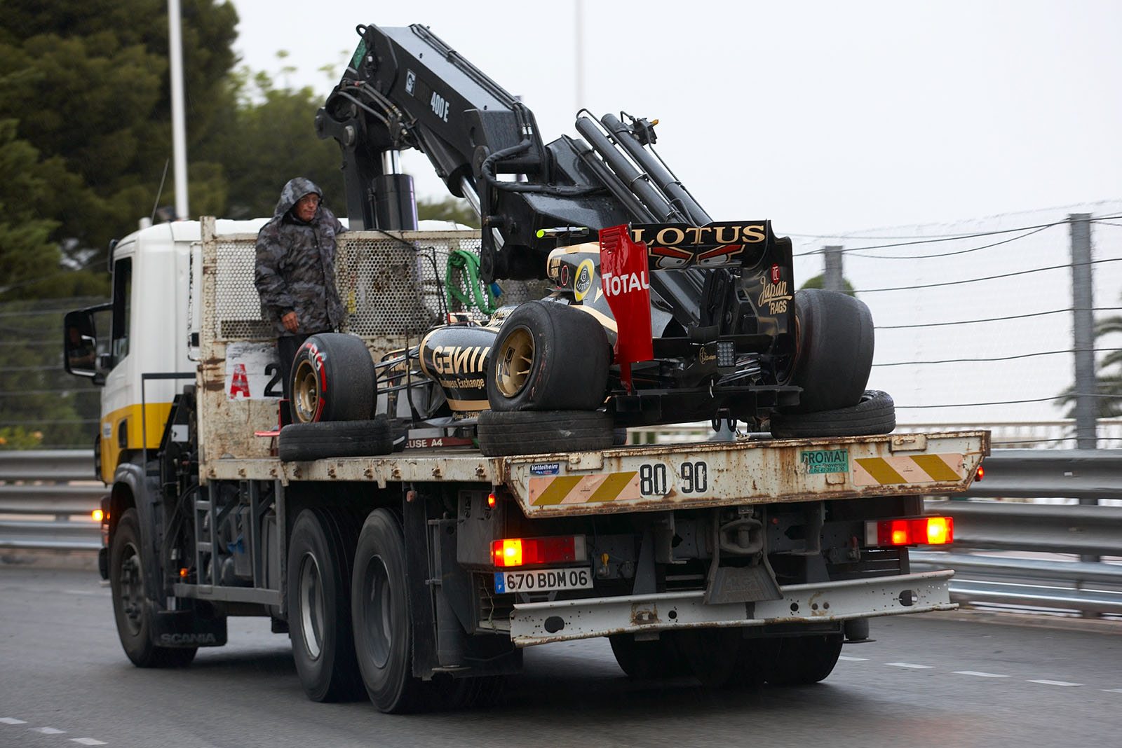 Grosjean's damaged Lotus-Renault is returned after the race