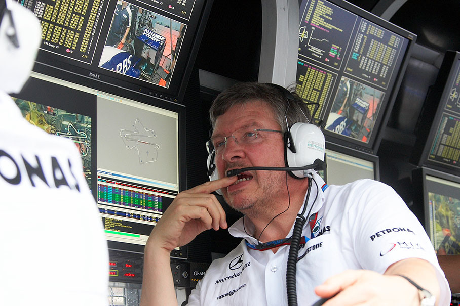 Team boss Ross Brawn thinks at Mercedes' pit wall command center