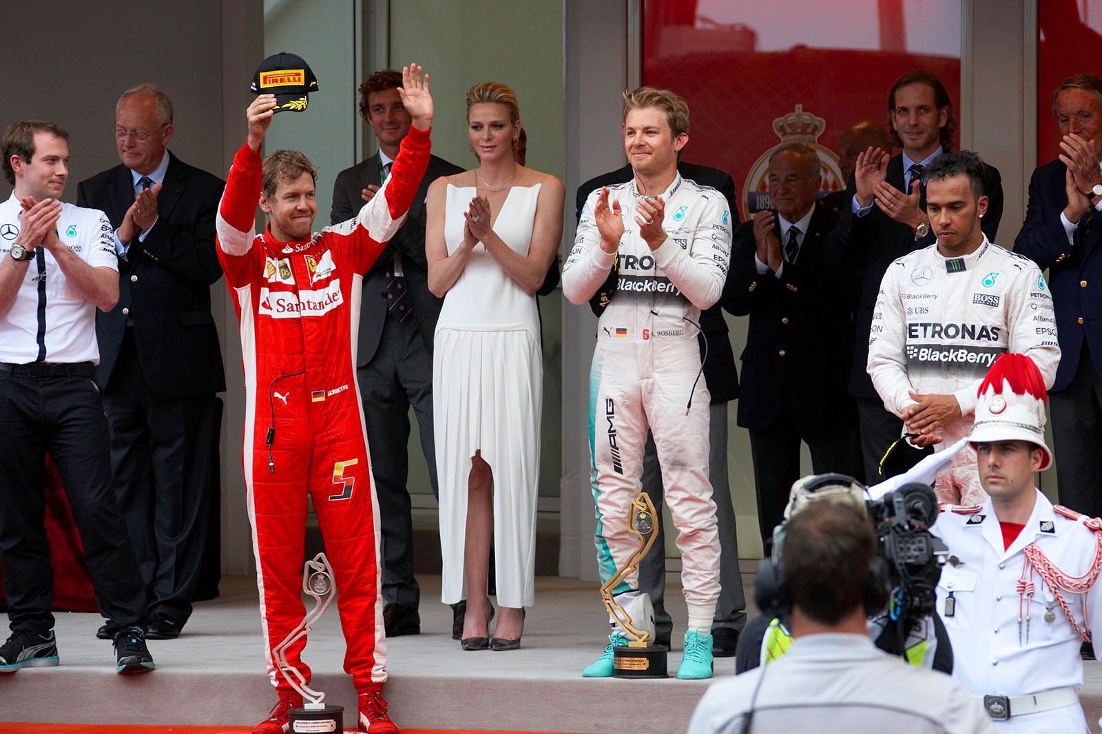 Sebastian Vettel, happy by finishing 2nd, race winner Nico Rosberg, and a very sad Lewis Hamilton after his late race strategic error, Monte Carlo Grand Prix, 2015