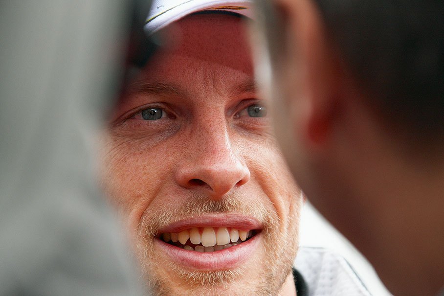 Jenson Button is being interviewed after qualifying
