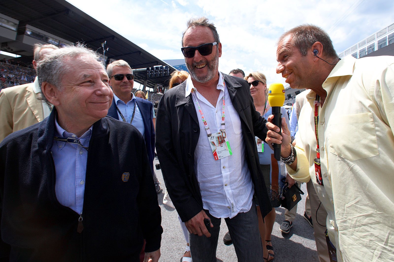 Jean Reno on the grid, surrounded by FIA president Jean Todt and Kai Ebel of RTL TV