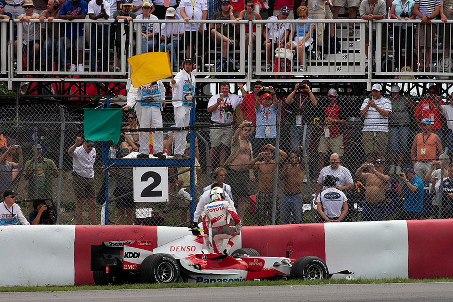 Trulli exits his damaged car. "When I pitted for the last time I came back out in last place I pushed too hard to catch the field and went into the wall." (Trulli's quote from Formula1.com)