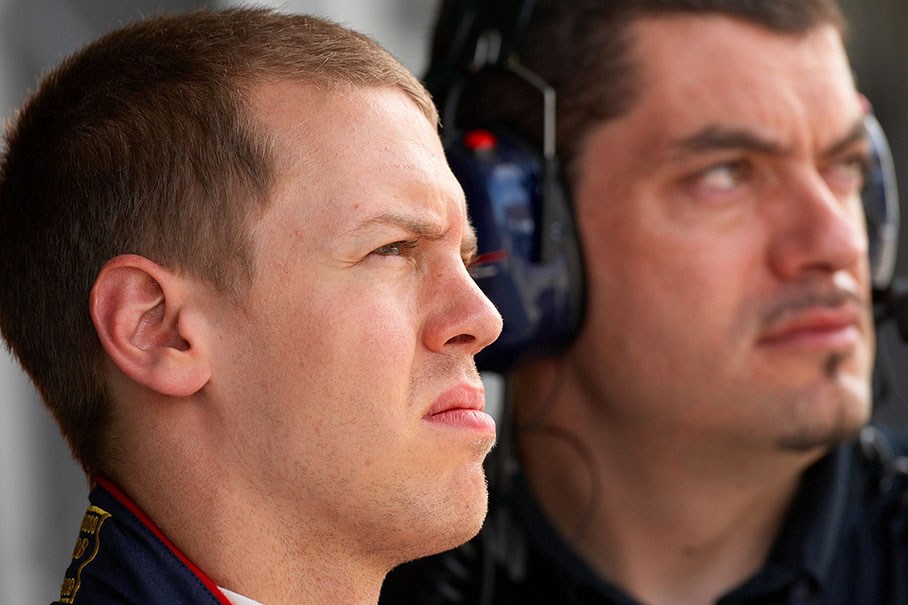 Sebastian Vettel watches the practice times with his Red Bull race engineer Guillaume Rocquelin