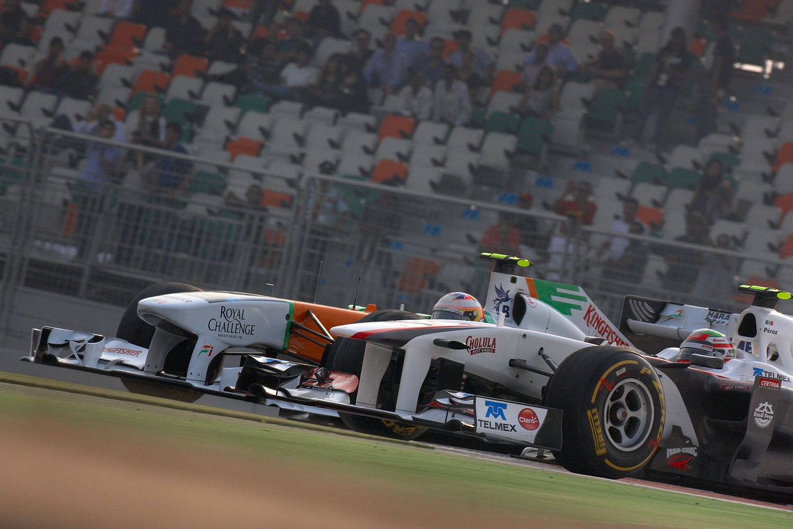 Sergio Perez, Sauber F1 Team, battles for position with Force India's di Resta