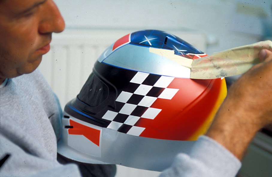 Peter Ginneken of BELL Helmets S.A. making the artwork of the 1998 Suzuka race helmet for Michael Schumacher