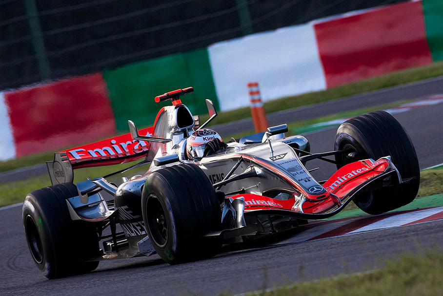 Kimi Raikkonen lifts a wheel of his McLaren-Mercedes