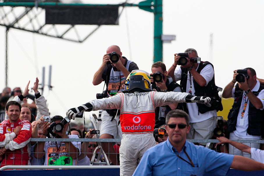 Lewis Hamilton celebrates his victory in parc ferme