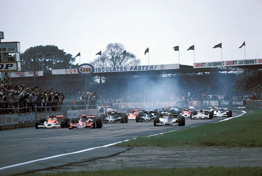 Start of the 1977 British GP Silverstone, Watson overtakes polesetter Hunt