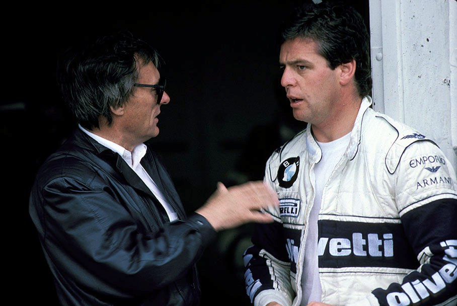 Bernie Ecclestone in discussion with Derek Warwick