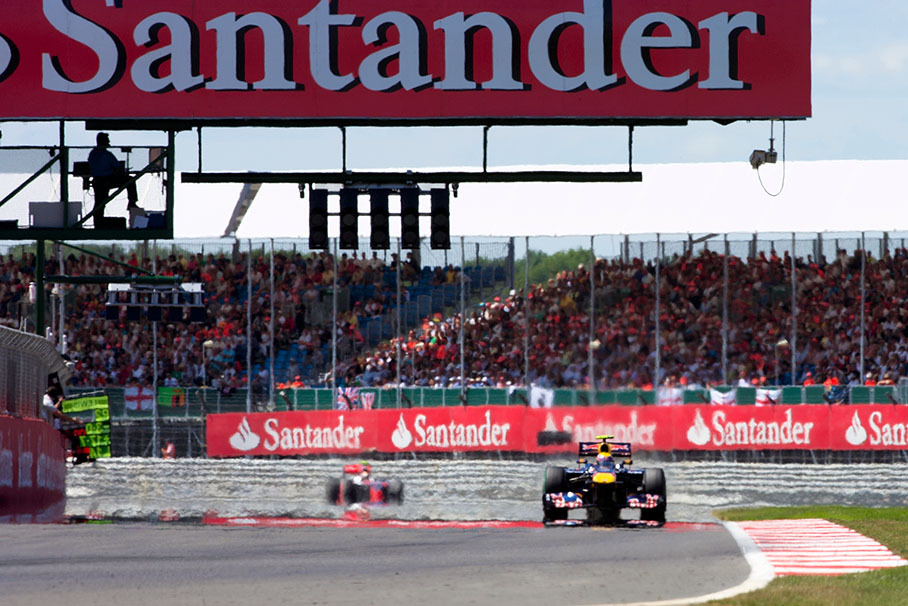 Red Bull's Mark Webber leads the race in front of Hamilton