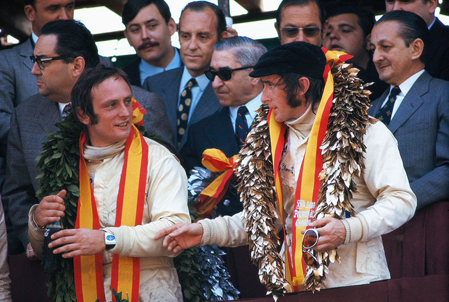 Chris Amon (left) and Jackie Stewart celebrating their 3rd and 1st place at the Spanish Grand Prix.