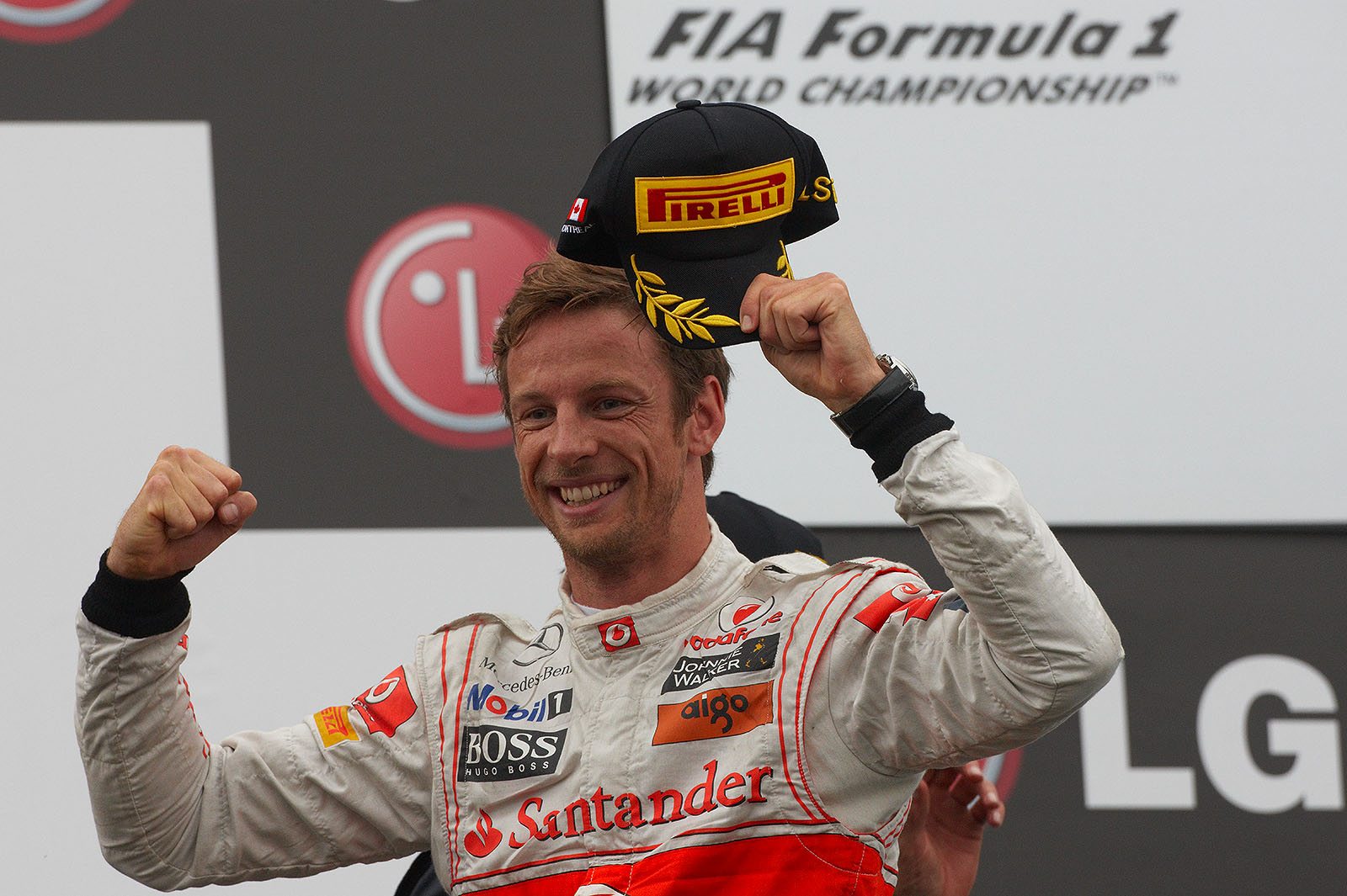 A happy and victorious Jenson Button on the podium after the Canadian Grand Prix 2011, his first win after the Chinese GP back in 2010