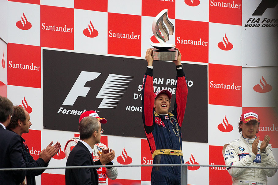 First placed and youngest Grand Prix winner of all times Sebastian Vettel presents his trophy