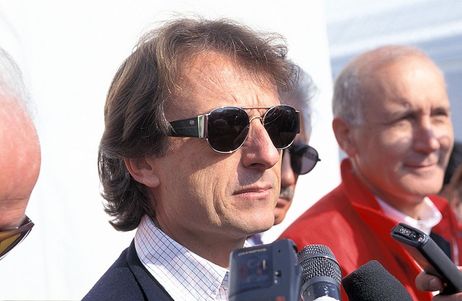 Ferrari president Luca Cordero di Montezemolo is being interviewed (with Ferrari's director of communications, Antonio Ghini, in the background)