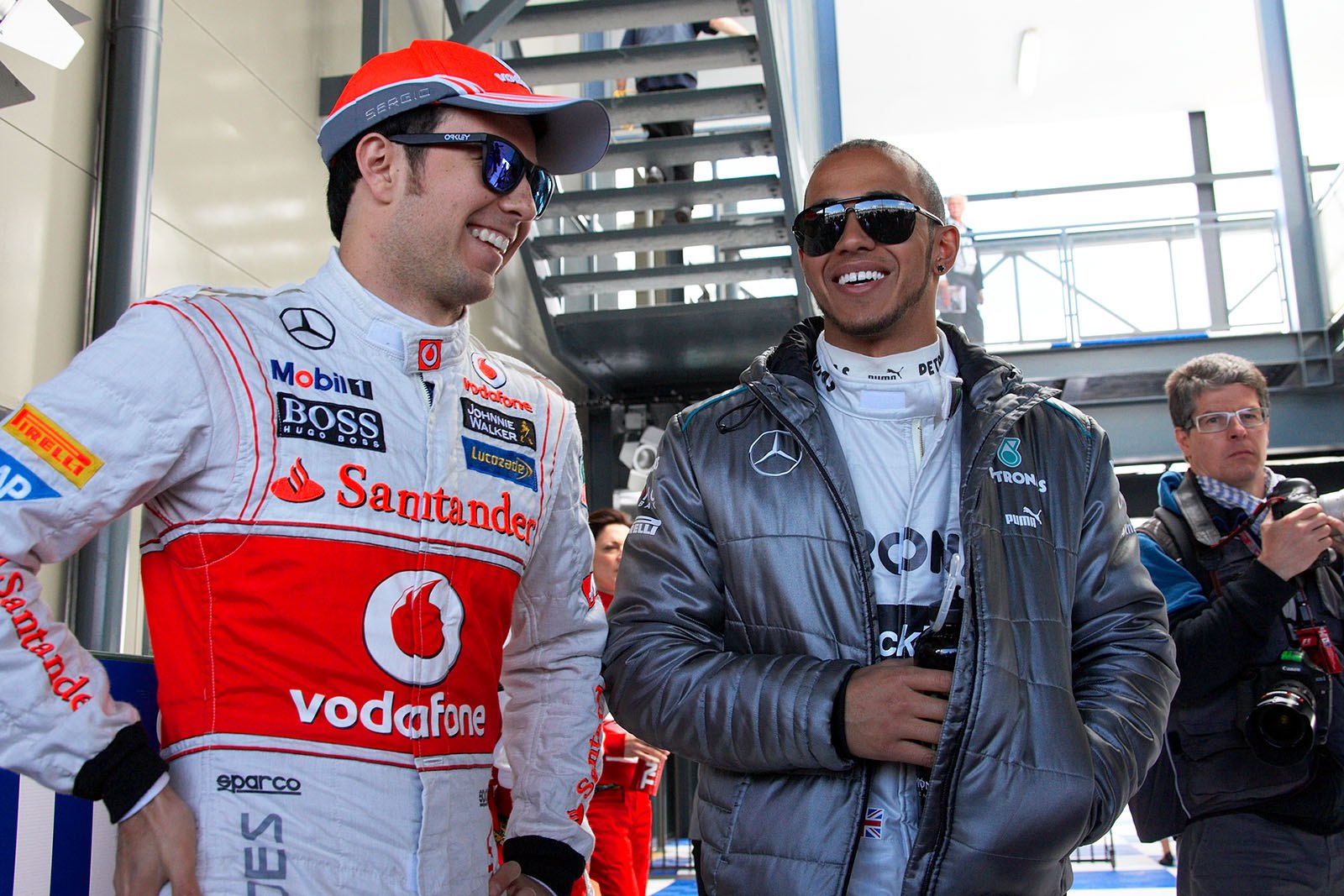 Race drivers wait for the drivers parade - McLarens Sergio Perez and Lewis Hamilton of Mercedes