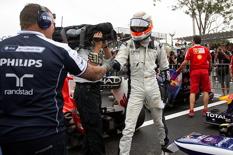 A very happy polesetter Nico Hulkenberg receives congratulations from a Williams mechanic at parc ferme