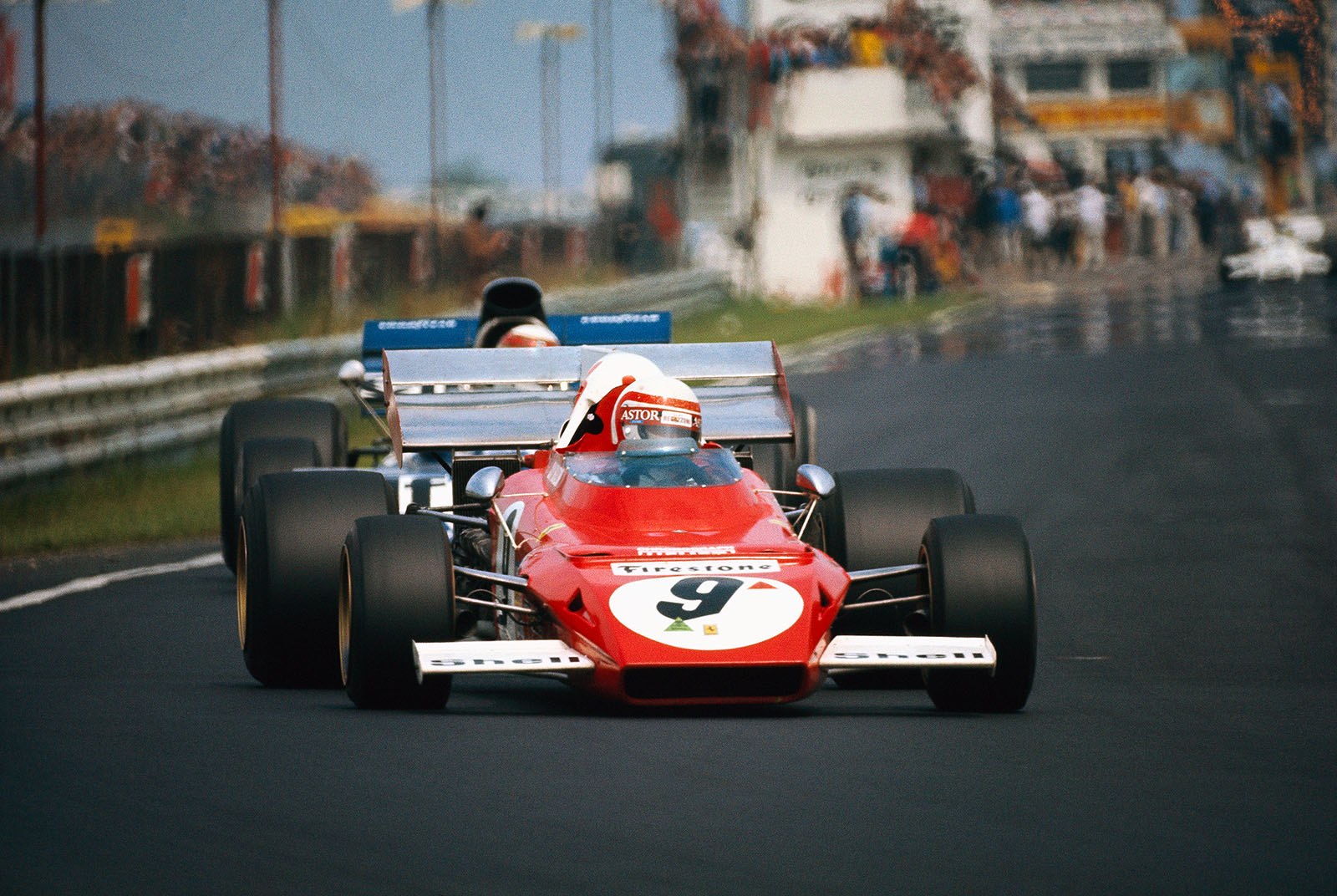 Clay Regazzoni, Ferrari, closely followed by Stewart's Tyrrell