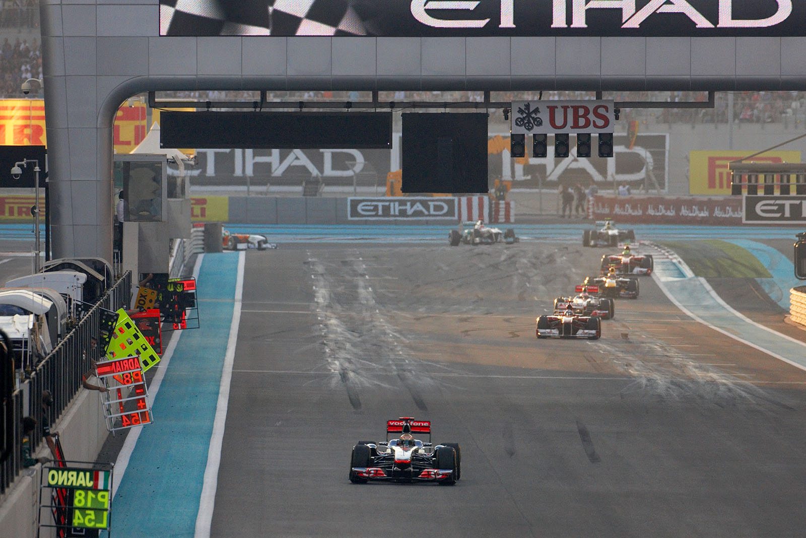 Race leader Lewis Hamilton of McLaren Mercedes passes the pit boards as the field turns to the main straight