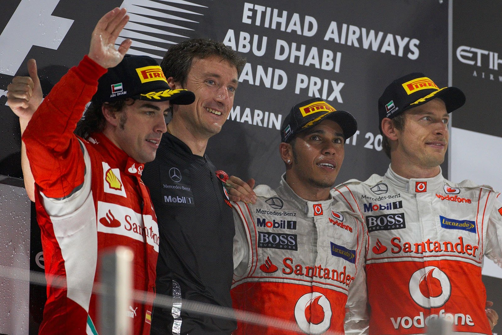 Final podium ceremony group photo of second placed Fernando Alonso of Ferrari, McLaren's Andy Latham, race winner Lewis Hamilton and his third placed team mate Jenson Button of McLaren