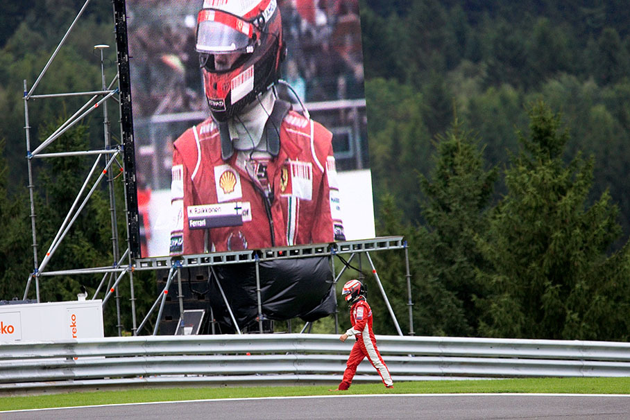 A sad retired Raikkonen walks back to pits after the race finish