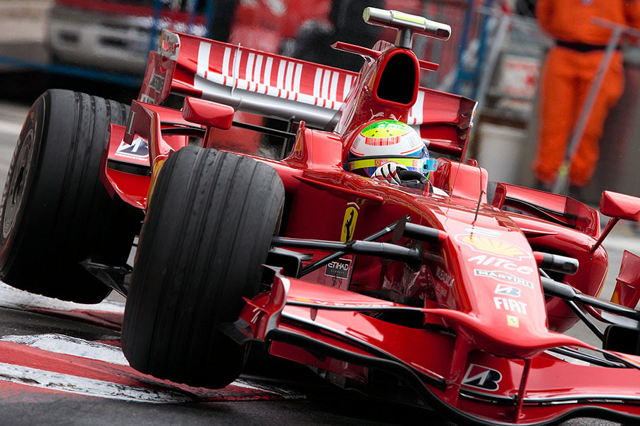 Ferrari's Felipe Massa jumps at Nouvelle Chicane curbs