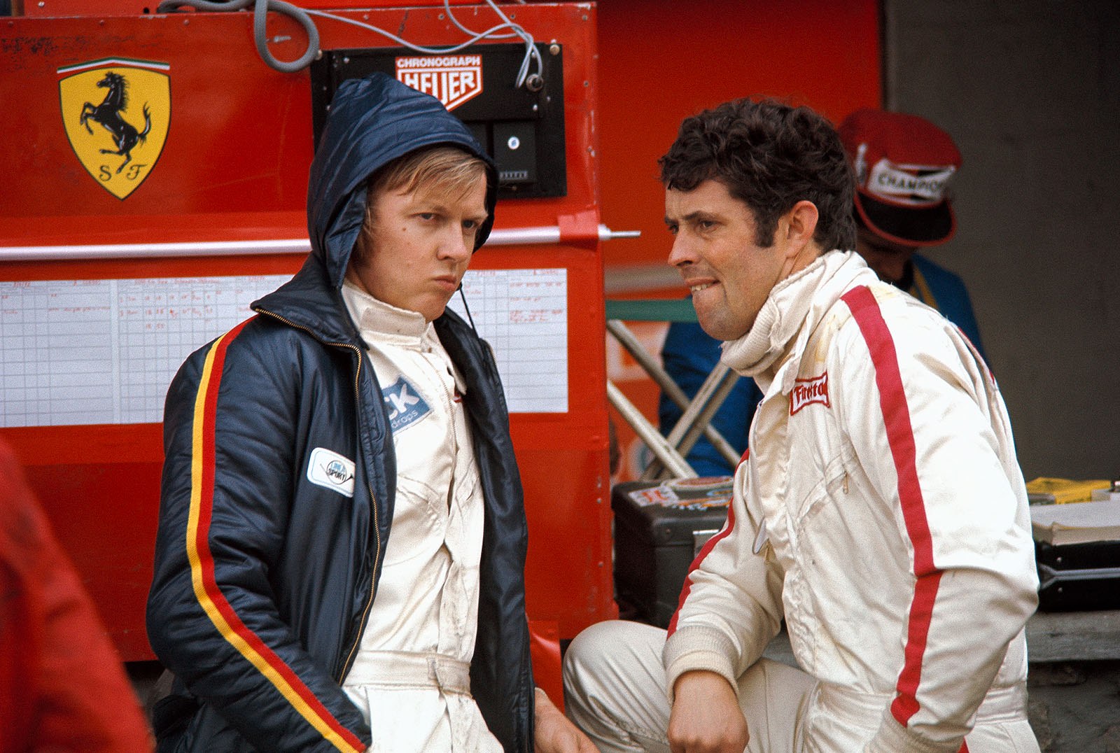 Ronnie Peterson (S) chats with Ferrari team mate Brian Redman (GB)