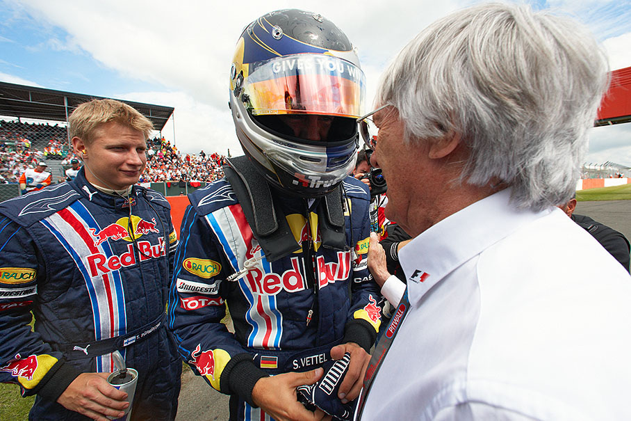 Before the race, Bernie Ecclestone wishes polesitter Sebastian Vettel the best of luck besides the grid