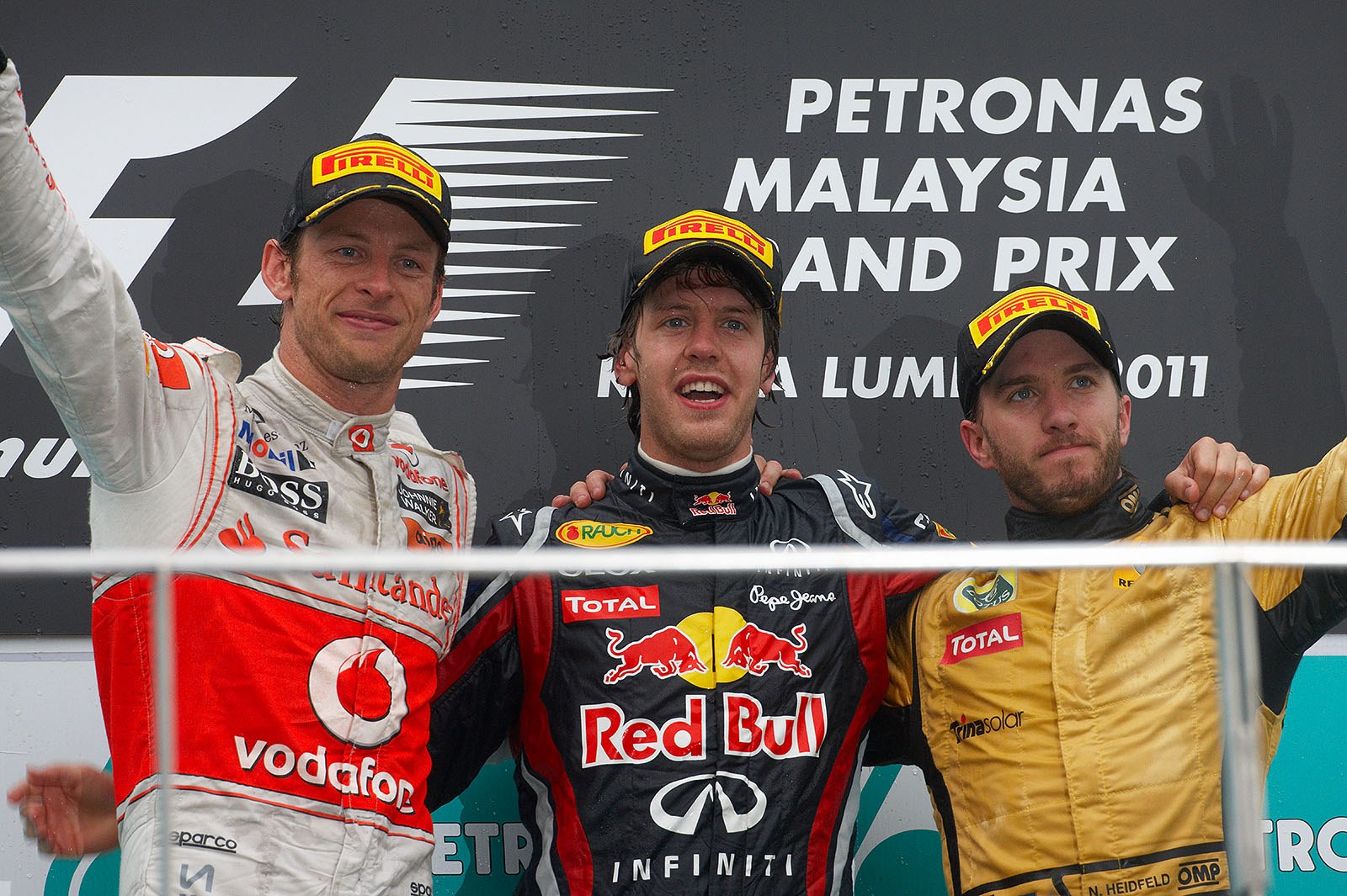 Final podium ceremony group photo of second placed Jenson Button of McLaren, Red Bull's race winner Sebastian Vettel and an unexpected third placed Nick Heidfeld of Renault