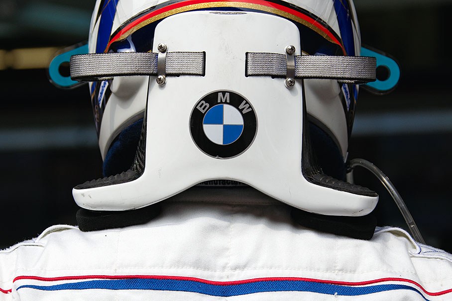 A shiny BMW emblem on Heidfeld's HANS device
