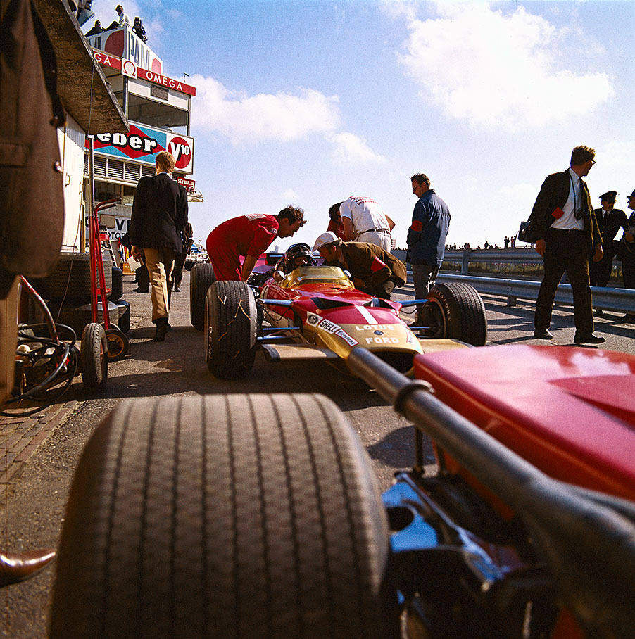 Graham Hill speaking to Lotus team boss Colin Chapman