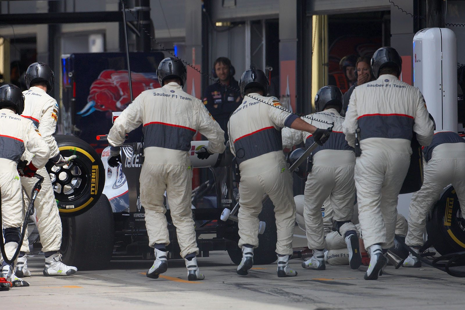 Kamui Kobayashi comes to Sauber pits besides the racing line and hits the mechanics on his right side