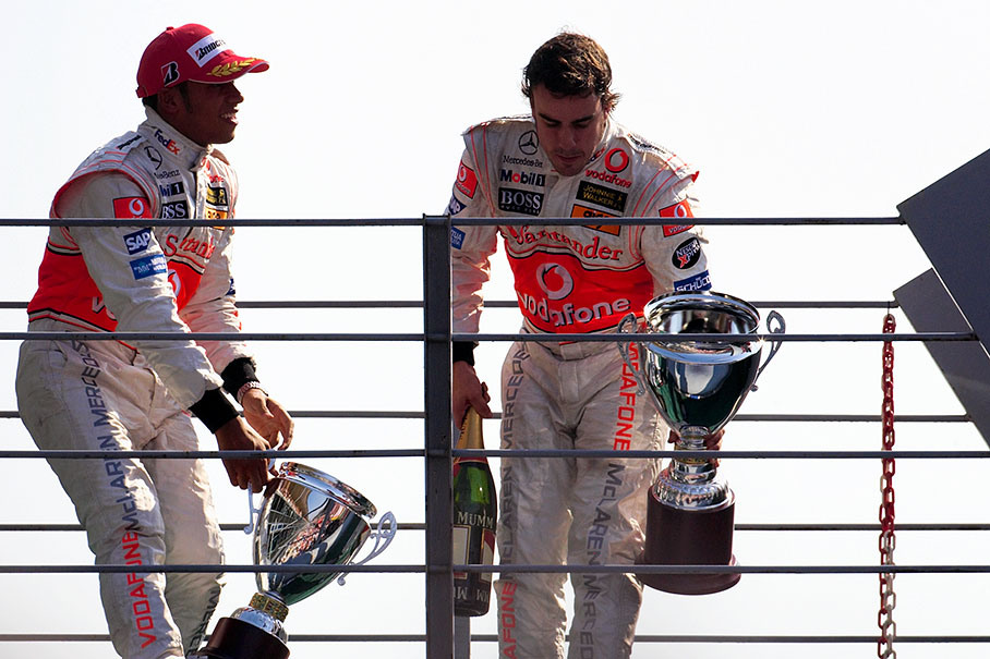 The victorious McLaren drivers Lewis Hamilton and Fernando Alonso on podium bridge